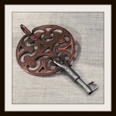 Framed photo of an antique African key